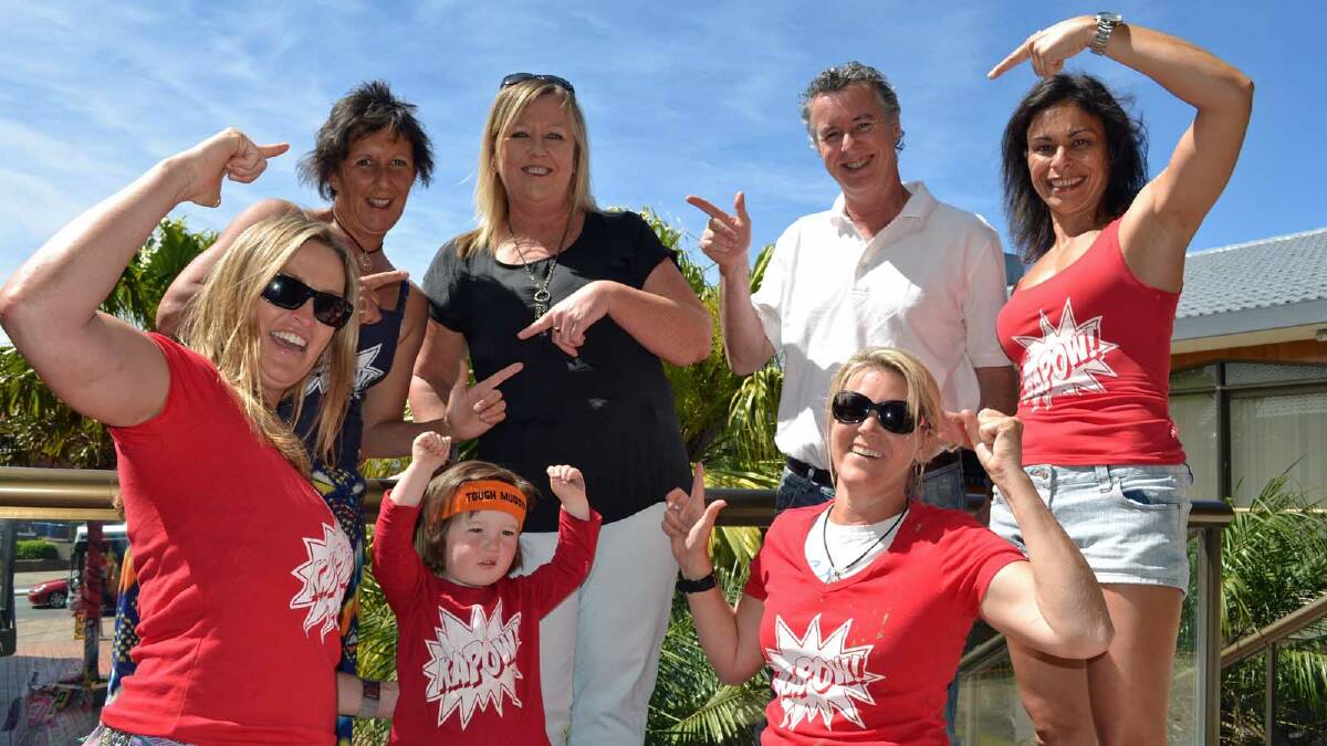Deb Elkins (LEFT), Gail Wild with raffle winner Carole Starr, Escape Lodge Owner Colin Bailie, Mo Dath , Susie Wessel with Kapow’s youngest supporter Balun Wild.