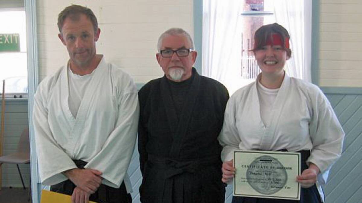  Earning his black belt was Brent Harding with Sensei Mick Smalley, while Jordon Root earned her ni-dan.