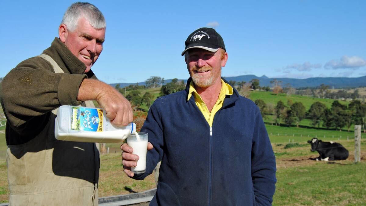 KEEP IT REAL: Milton dairy men Michael Ewin and Brian Anderson are encouraging shoppers to purchase only Dairy Farmers brand milk that is sourced from local farms and to avoid cheap generic brands that are “destroying the industry”.