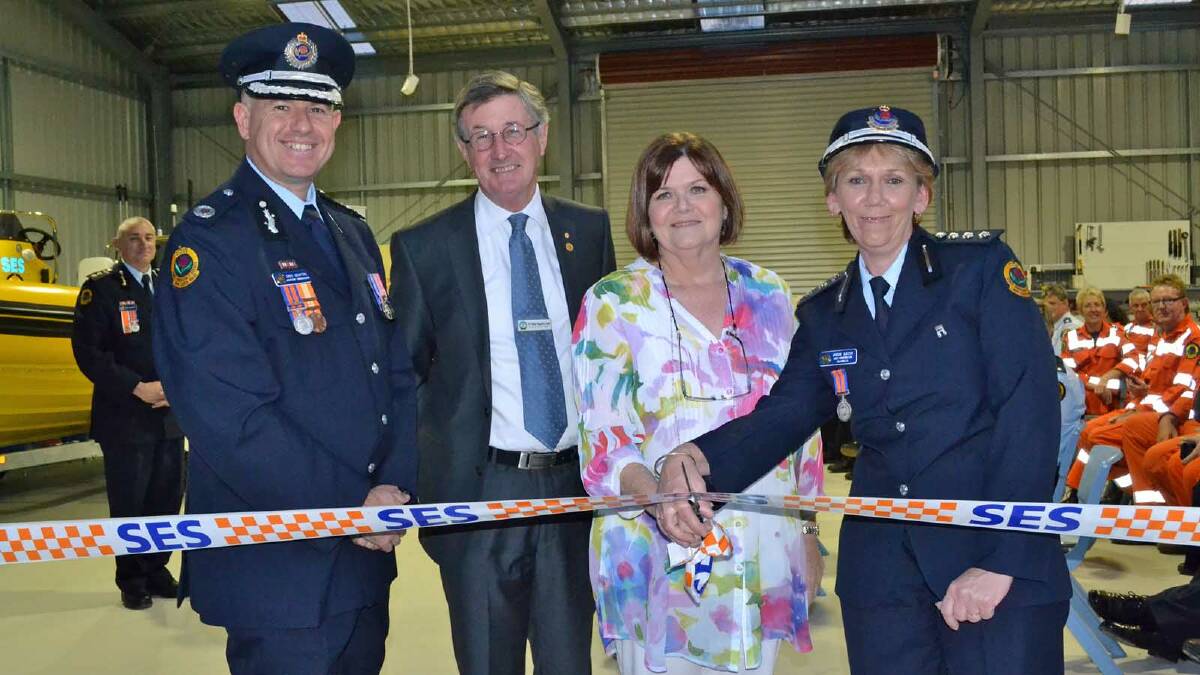 OPEN: Cutting a ribbon to officially open extensions to the Ulladulla SES headquarters are NSW SES assistant commissioner Greg Newton, Shoalhaven City Councillor Allan Baptist, South Coast MP Shelley Hancock, and unit controller Angie Batey.