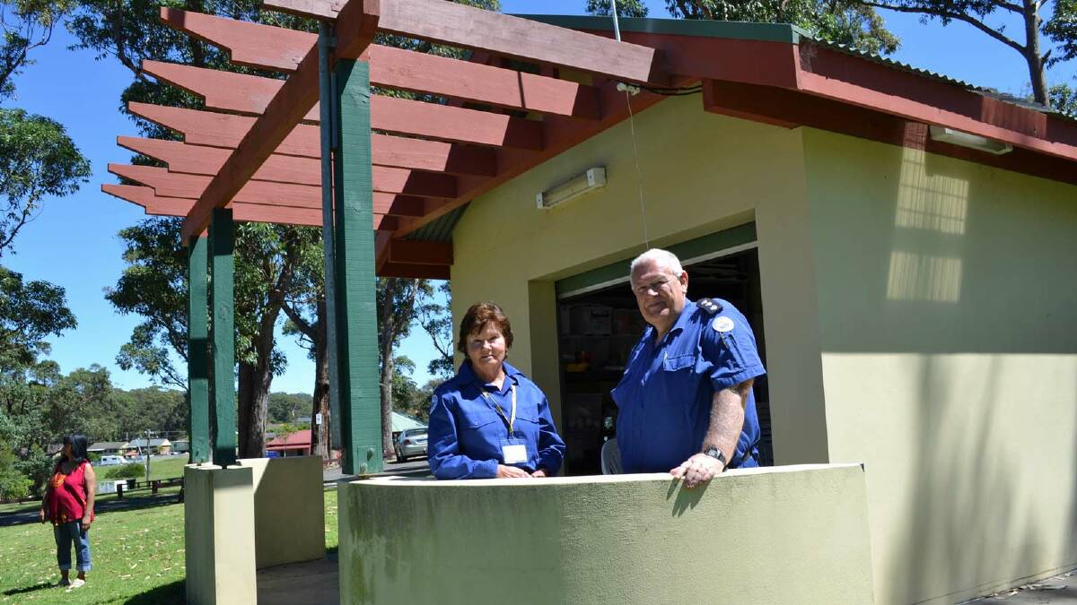STRONG SIGNALS: Ulladulla Marine Rescue volunteer Carol Hackney with Unit Commander Ken Lambert at the temporary radio base made available by the Ulladulla Game Fishing Club.  The Marine Rescue’s harbourside base and new training room were destroyed by fire on the long weekend.