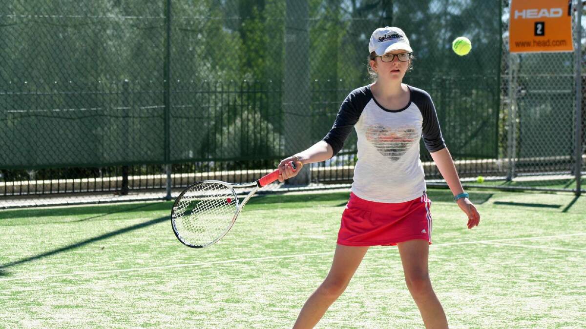 TERRIFIC TENNIS: Jasmine Sydenham enjoys a game of tennis with the Saturday Morning Junior Tennis competition. Photo by LISA GOLDBY.