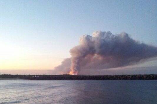 North Shore fires from Port Macquarie's breakwall, 6pm Saturday. Pic: Jess Dowdle