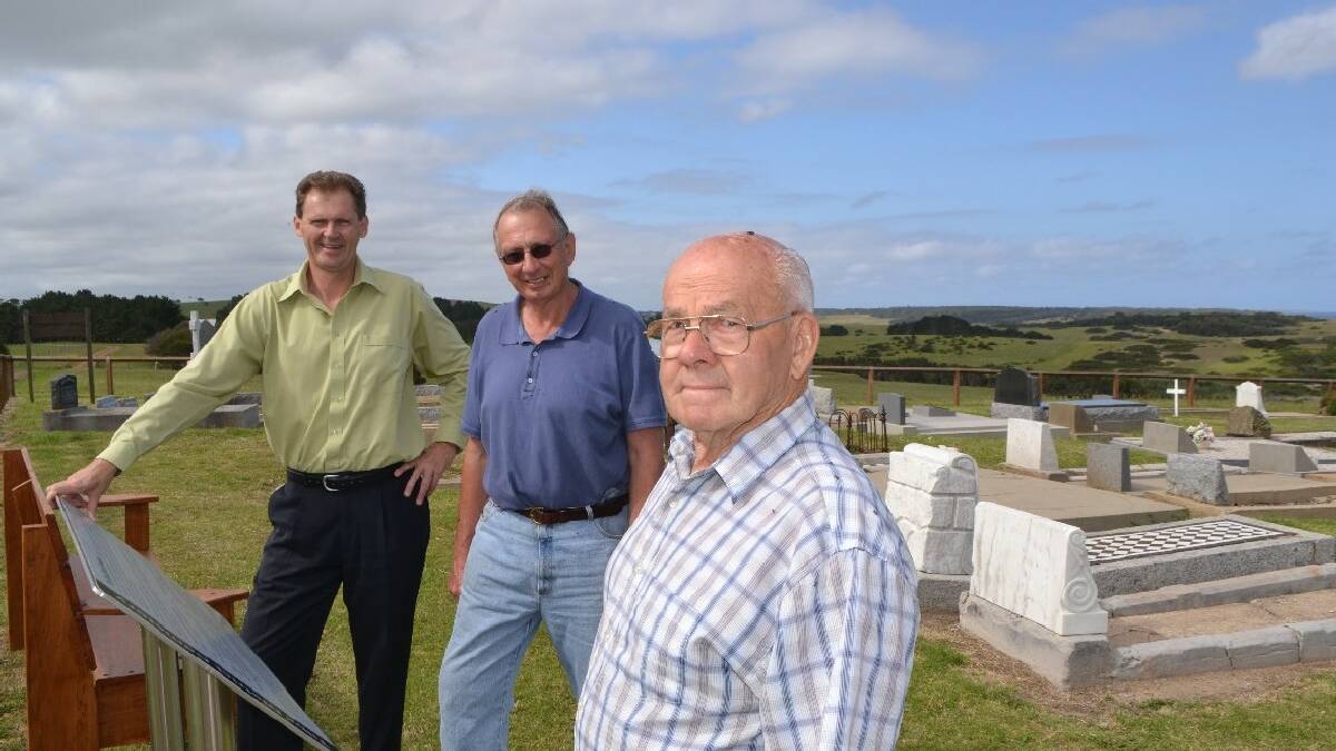 TILBA: Checking out the new sign and benches at   the picturesque Tilba Cemetery last week are   mayor Lindsay Brown and cemetery committee   members Harry Bate and Norm Hoyer.