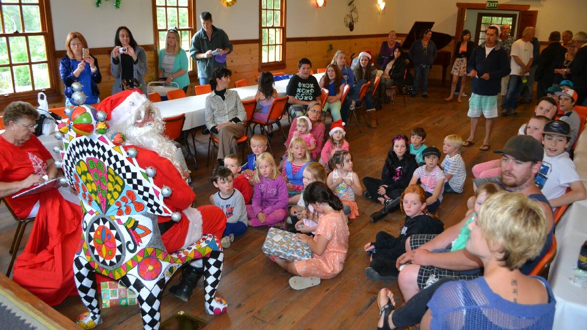 NETHERCOTE: Santa hands out gifts to all the   very, very nice children at the annual   Nethercote Christmas Party on Saturday.