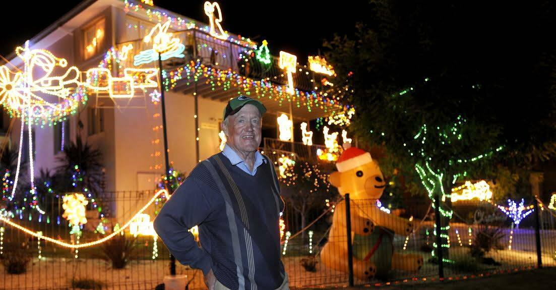  JINDABYNE: Former postie John McLoughlin starts putting   Christmas lights on his house at the beginning   of November. 