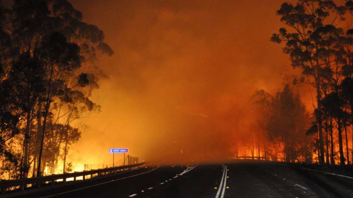 RATES RELIEF: Princes Highway at Sussex Inlet in the midst of the Currowan fires which claimed the lives of three people. Picture: NSW RFS
