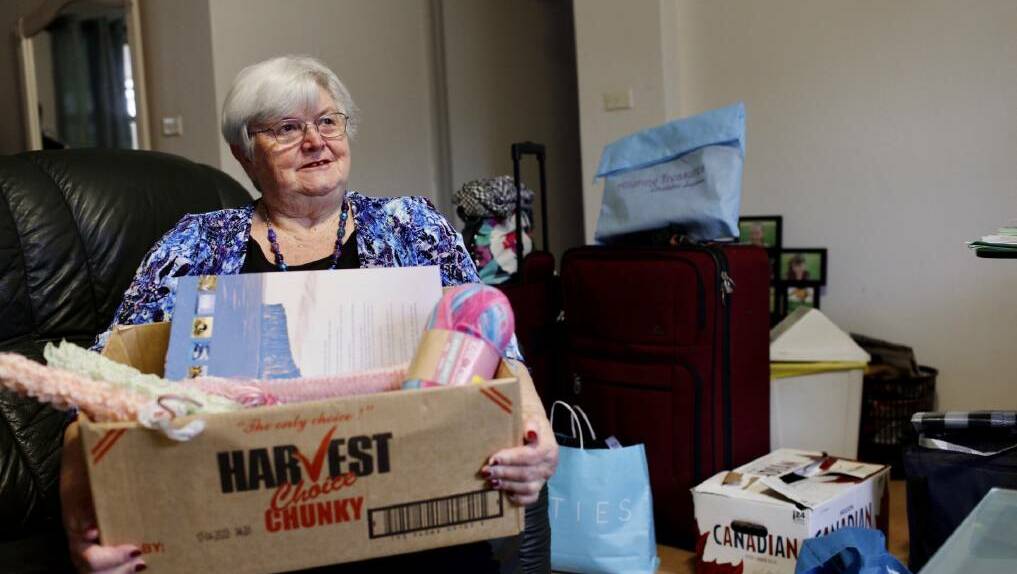 HOME: Housing Trust tenant Lyn Bailey pictured packing in 2020, ahead of her move into her Shellharbour property. File picture.