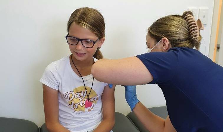 FIRST DOSE: Greenwell Point's Destiny Bux, 10, rolled her sleeve up for her first COVID vaccine at Culburra Beach Medical Centre on Monday, January 10.