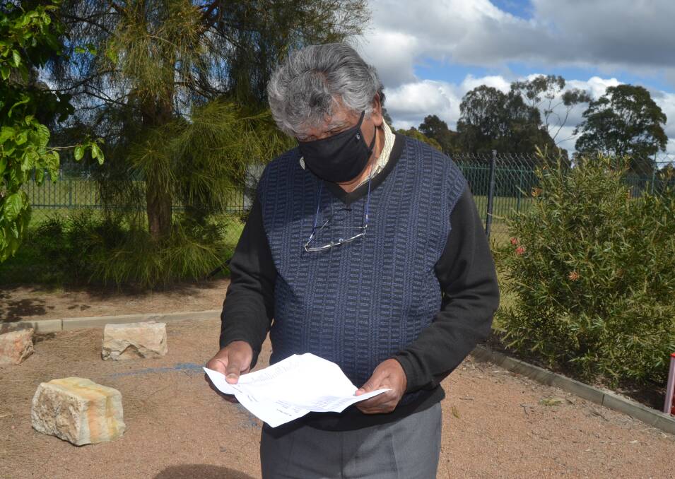 VACCINATED: Uncle Tom reading his long list of immunisations he has had in his lifetime, provided to him by his GP. Image: Grace Crivellaro.