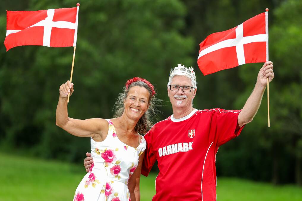 Karina Woodward and Ole Larsen wave their Danish flags on January 14. Picture by Adam McLean
