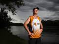 Googong's Chad Fraser, 41, started running after struggling with his parents' deaths. Picture by Sitthixay Ditthavong