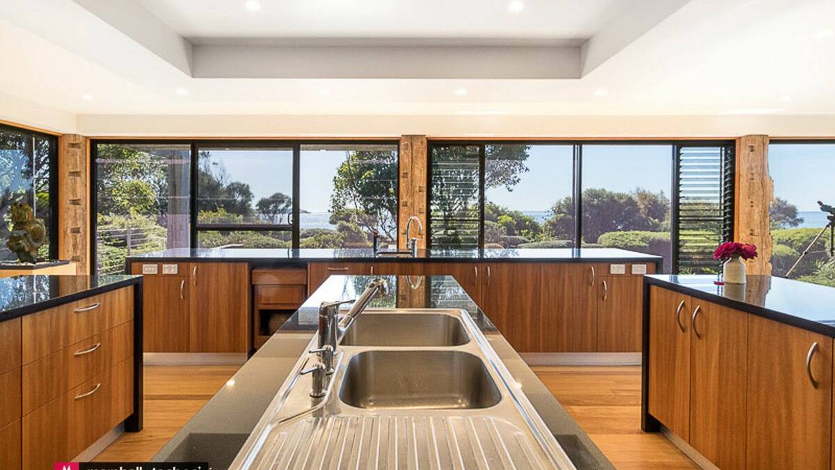 The large kitchen overlooks the gardens and ocean. Picture supplied