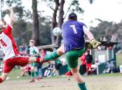 KEEPING STRONG: Huskisson's Christopher Tweed protecting their goal against Basin's Owen Browne. Picture: TAMARA LEE