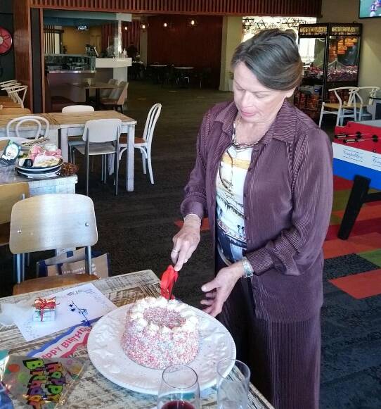 New member and Treasurer, Maree Skrzypek cutting the birthday cake. Picture: Supplied. 