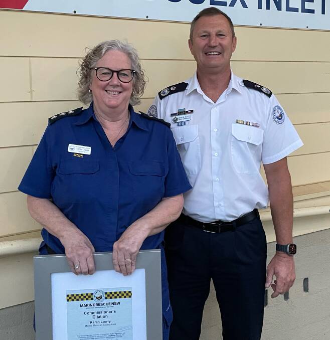Karen Lowry receives her citation from Marine Rescue NSW Deputy Commissioner Darren Schott. Picture supplied.