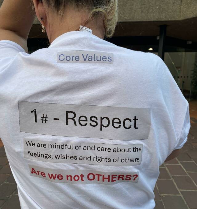 One of the T-shirts talking about Shoalhaven Council's core values, and how they are applied, worn to the April 8 meeting. Picture by Glenn Ellard.