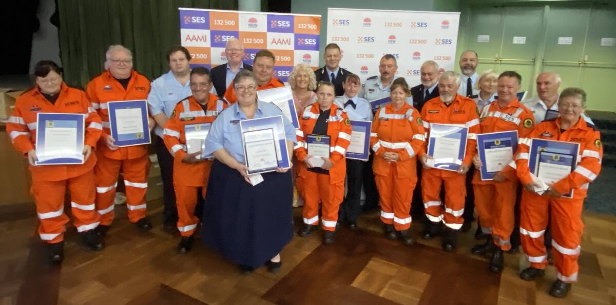Some of the Nowra SES unit members for received awards, pictured with State Member for Kiama, Gareth Ward, State Member for South Coast Liza Butler, and NSW SES Deputy Commissioner Daniel Austin. Picture by Glenn Ellard.