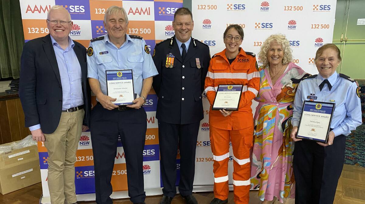 Some of the St Georges Bain SES members who received awards, pictured with State Member for Kiama, Gareth Ward, NSW SES Deputy Commissioner Daniel Austin and State Member for South Coast Liza Butler. Picture by Glenn Ellard.