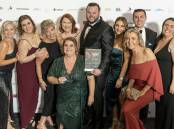 Shoalhaven Business Chamber president Jemma Tribe pictured with the team from the chamber's 2023 business of the year - Bumpy Road Catering and Events. Picture supplied.