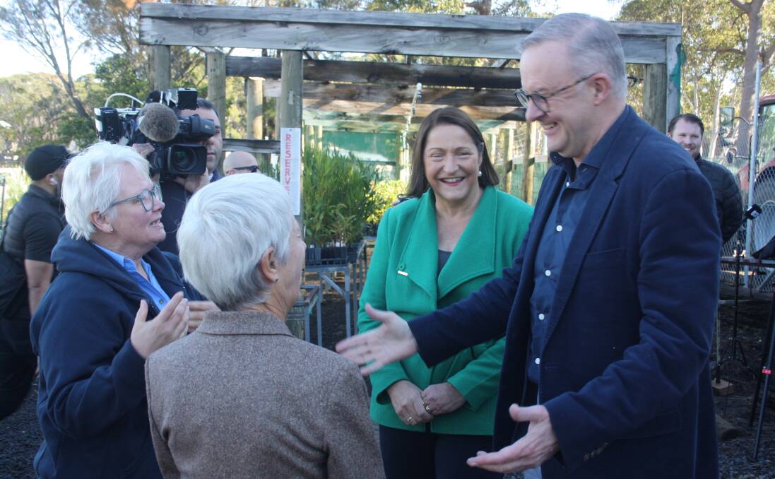 Prime Minister Anthony Albanese and Federal Member for Gilmore, Fiona Phillips, are welcomed to the Milton Rural Landcare nursery by Penny Hand and Penny Lumb. Picture by Glenn Ellard.