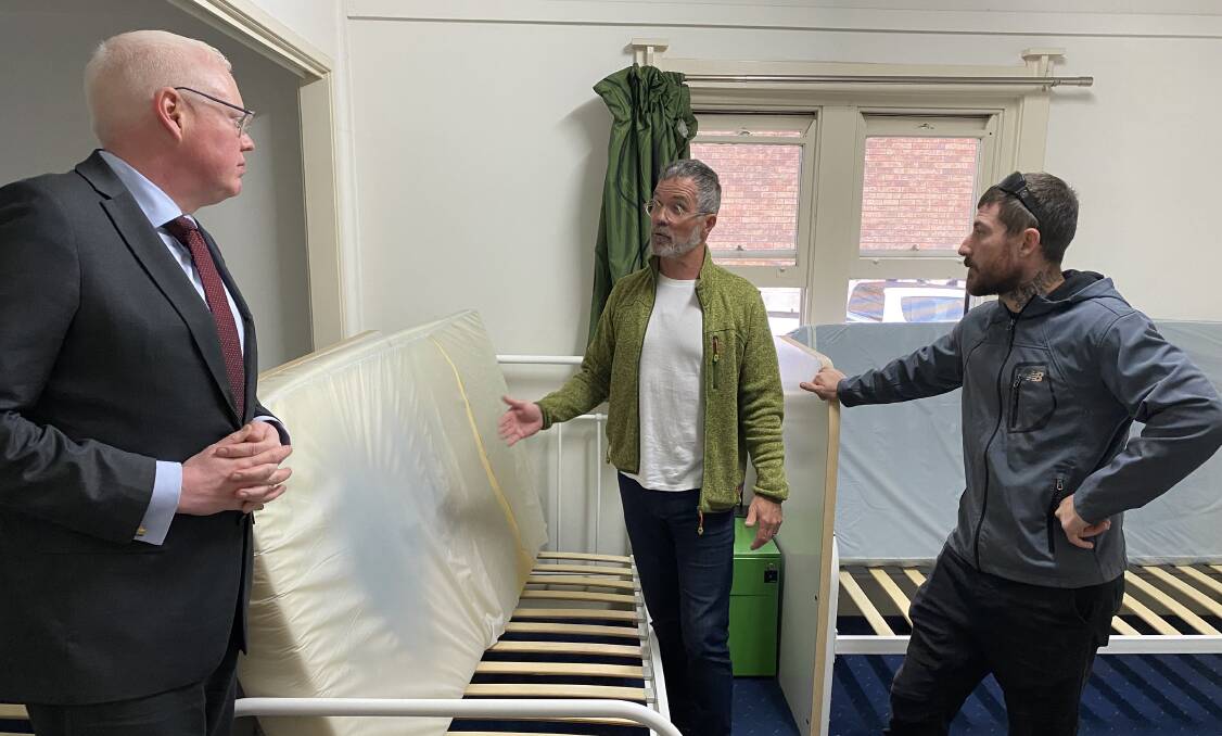 State Member for Kiama, Gareth Ward, discusses the future of services for homeless people with Salt Care CEO Peter Dover and manager of temporary accommodation, Daniel Laughton. Picture by Glenn Ellard.