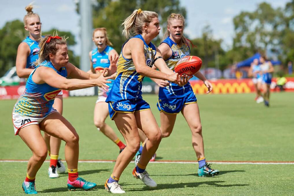 Nowra's Maddy Collier gets a handball away during West Coast's win against Gold Coast. Photo: Eagles Media
