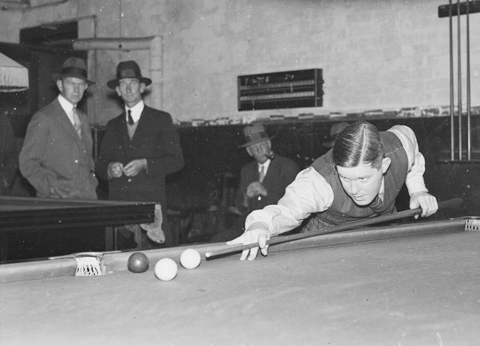 Best there's ever been: Billiards grand master Walter Lindrum taking a shot during a match in NSW in April 1934.