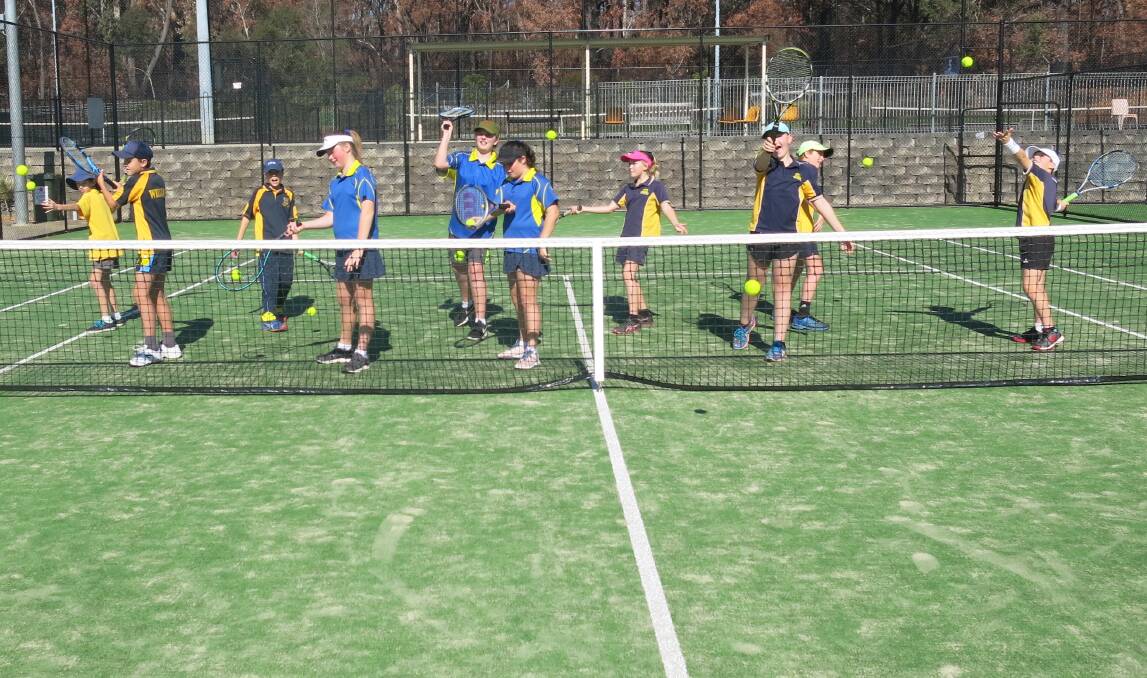 South Coast's best: Milton Public School's team of Kolt, Will, Tom, Claire, Maggie and Grace have a practice hit with the team from Wagga South Public School.