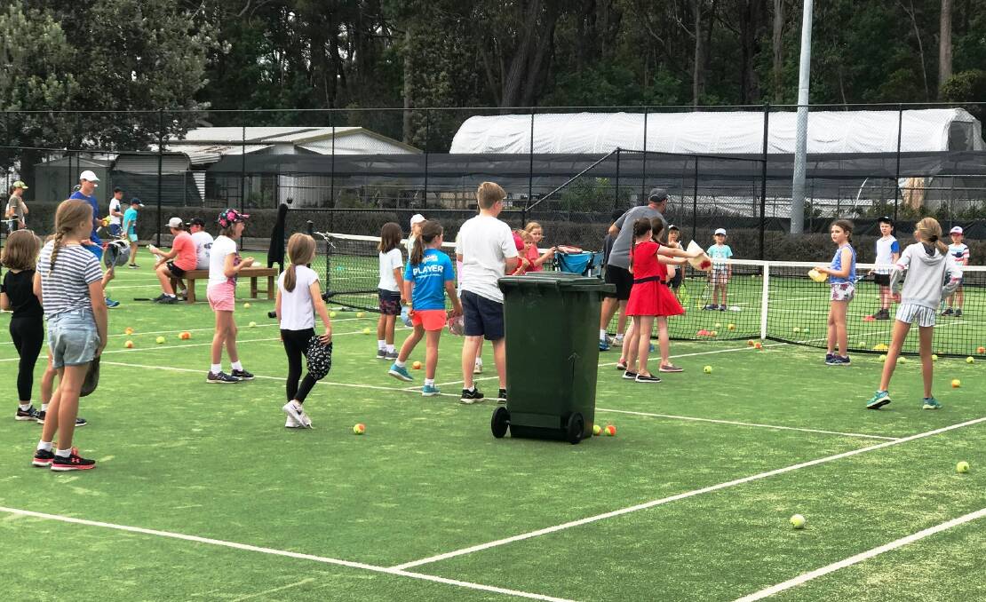 Having a ball: Kids enjoy learning the skills of tennis at the Ulladulla courts during the school holidays. The final holiday clinics will be held next week.