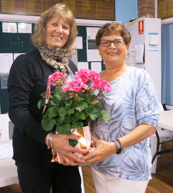 GRATEFUL: Jan Shalhoub receiving her voucher and flowers from president Pauline McIlveen for her seven years on the committee. 