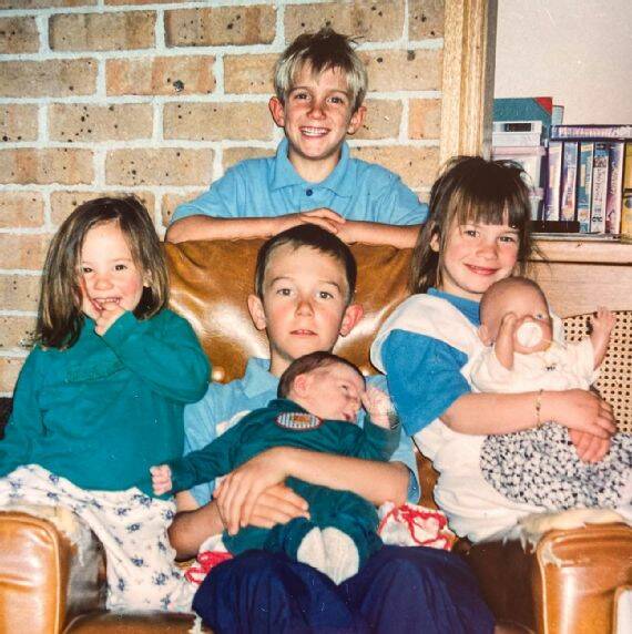Owen Wright (back) with siblings Tyler, Tim, Mikey and Kirby. Photo: Supplied