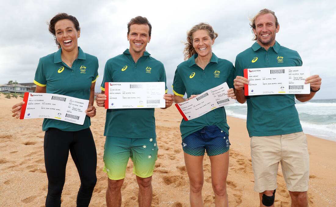 Australia's Sally Fitzgibbons, Julian Wilson, Stephanie Gilmore and Owen Wright with their Olympic Games tickets. Photo: Brendon Thorne
