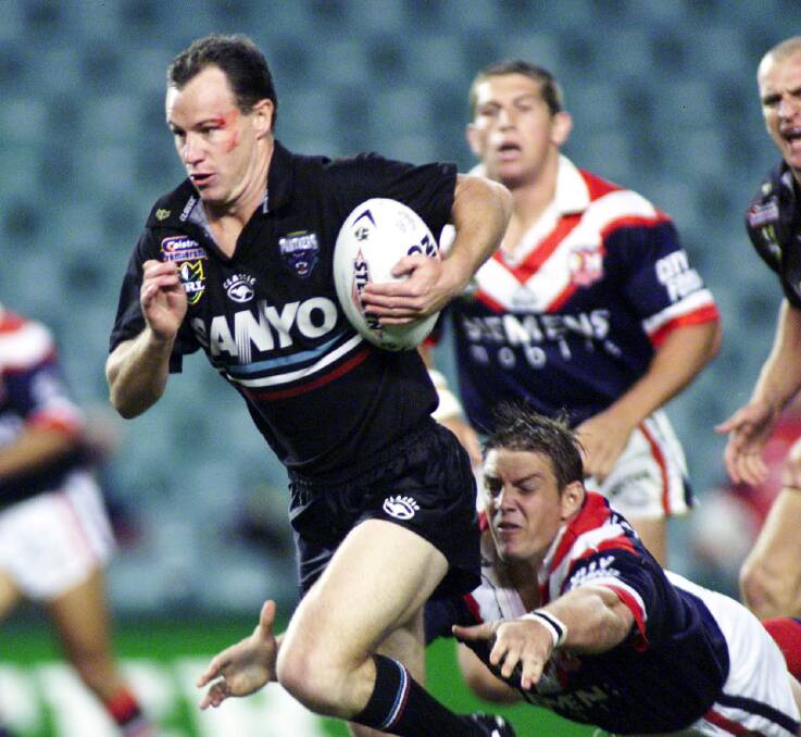 Justin Holbrook makes a break for the Panthers during his playing days. Photo: Colin Whelan