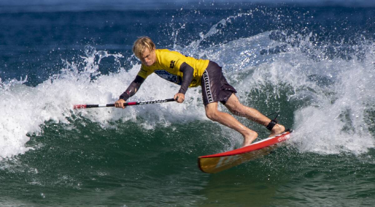 Mollymook's Kai Bates on his way to winning the NSW SUP title. Photo: Josh Brown/Surfing NSW