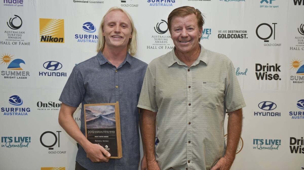 Russell Bierke receives his Heavy Water Award from a Surfing Australia representative. Photo: Surfing Australia/Nikon Australia 