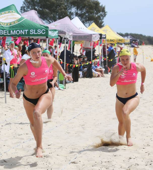 Payton Williams (right) finishes second in the female beach sprint on Saturday. Photo: SLSNSW