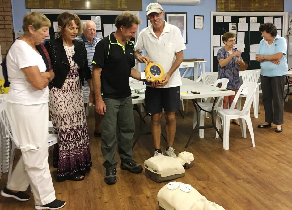 Heart starter: Paul Woodcock examines MUDTA's new defibrillator with trainer Mark McCarthy before joining volunteers learning how to use it on the mannequins.