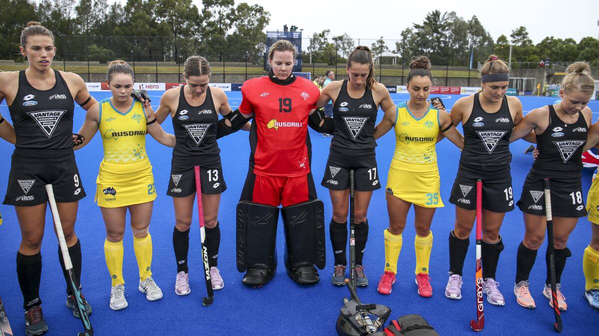 Hockeyroos' Kalindi Commerford (second from left) during a minute's silence for the Christchurch victims. Photo: HA