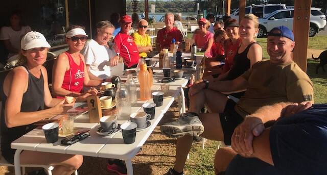 A perfect Sunday morning: Ulladulla Rats relax and enjoy coffee at Playgrounds cafe, Narrawallee Inlet.