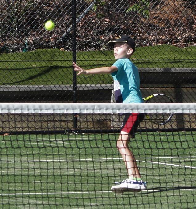 Eyes on the ball: Division 2 Team Pinches captain, Kolt Pinche, playing Saturday Morning Competition at the Uulladulla courts. 
