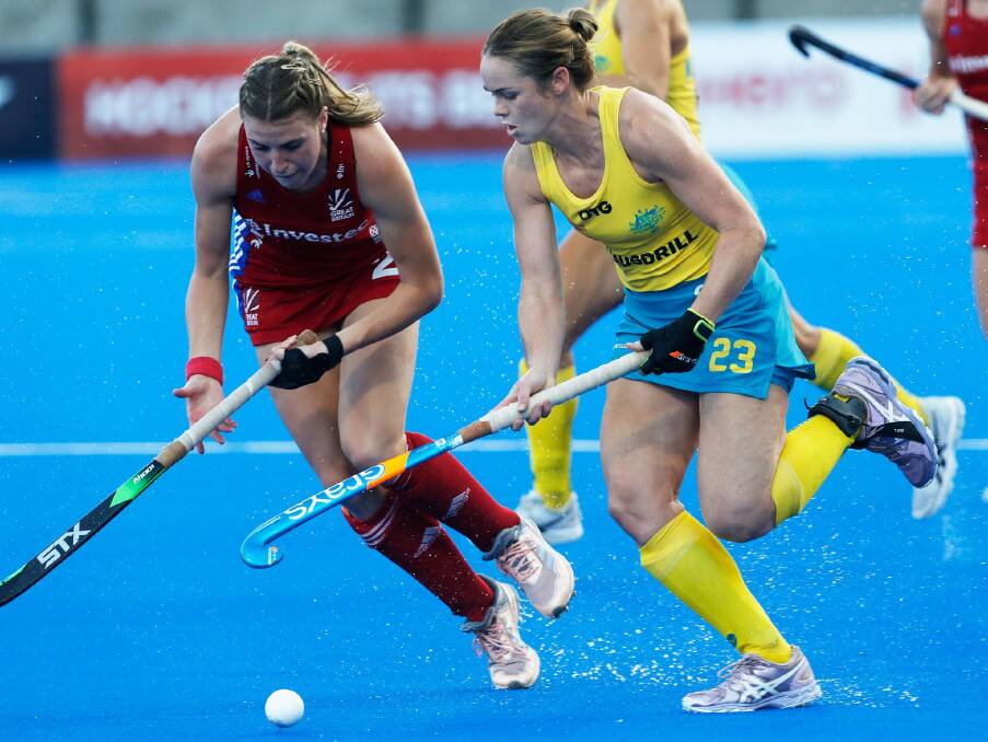 Hockeyroos' Kalindi Commerford tries to win possession against Great Britain. Photo: HOCKEY AUSTRALIA
