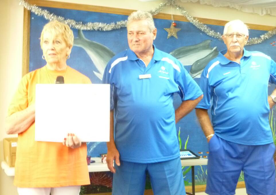 Mollymook Men's Bowls: Milton Hospital Auxiliary president Judy Bond receives a cheque for $4000 from vice-president Dave Beavis on behalf of Mollymook bowlers. President Darcy Nelson looks on.