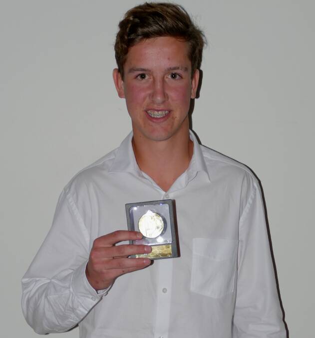 ALL SMILES: Ulladulla Dockers’ Harrison Donohue with his reserve grade best and fairest award, presented at Sunday's ASL South Coast presentation dinner. Photo: SARAH JOHNSON