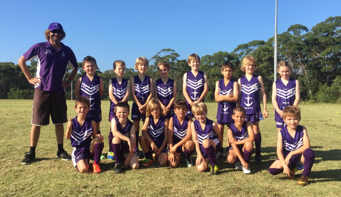 Family friendly club: The Ulladulla Dockers under 9’s with coach Brendan Riddick. The club is holding a "come and try" day this Sunday. 