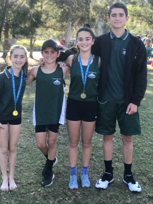 Hailey D'Ombrain, Blake D'Ombrain, Maddison D'Ombrain and Harrison D'Ombrain at the regional cross country carnival in Cambewarra.