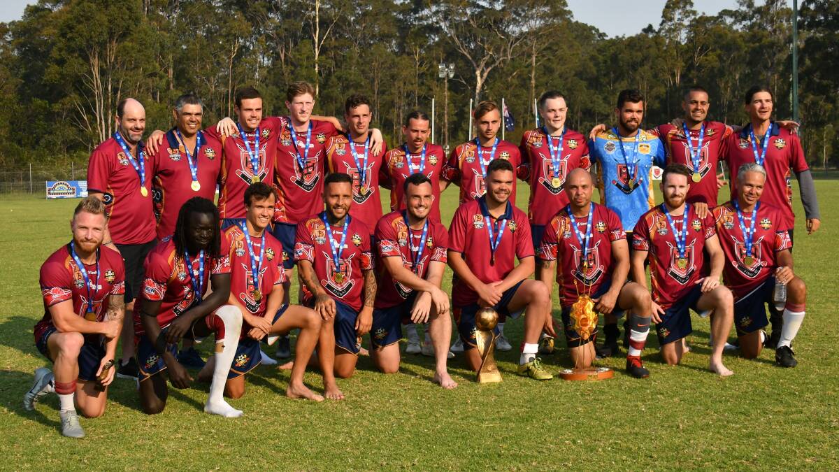 Mark Bridge (front row, fifth from left) and his Northern Nations FC team that won the 2019 National Indigenous Football Championships. Photo: JAKKI HAYDOCK