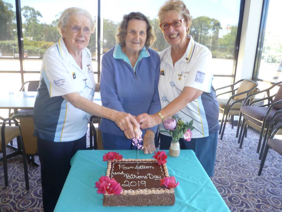 Milton Ulladulla Women's Bowls: Betty Longford, Cecile Hallahan and Jan Winter cutting the Patron/Foundation Day cake.