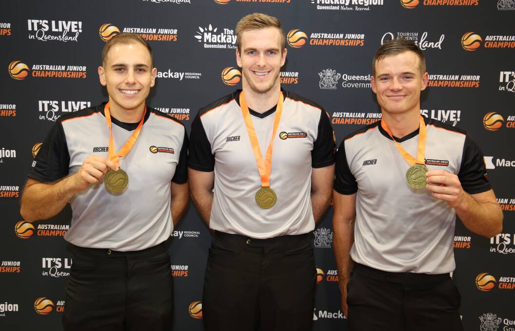 Tom Marsh (right) with Bradley Mattioli and Michael Beevers (both also from NSW) after officiating the under 20 men's grand final. Photo: Basketball Australia