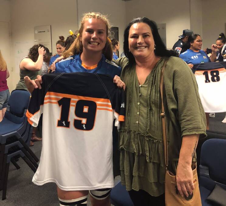 Grace Sullivan, with mother Lisa Elmas, after receiving her debut jersey. Photo: SUPPLIED